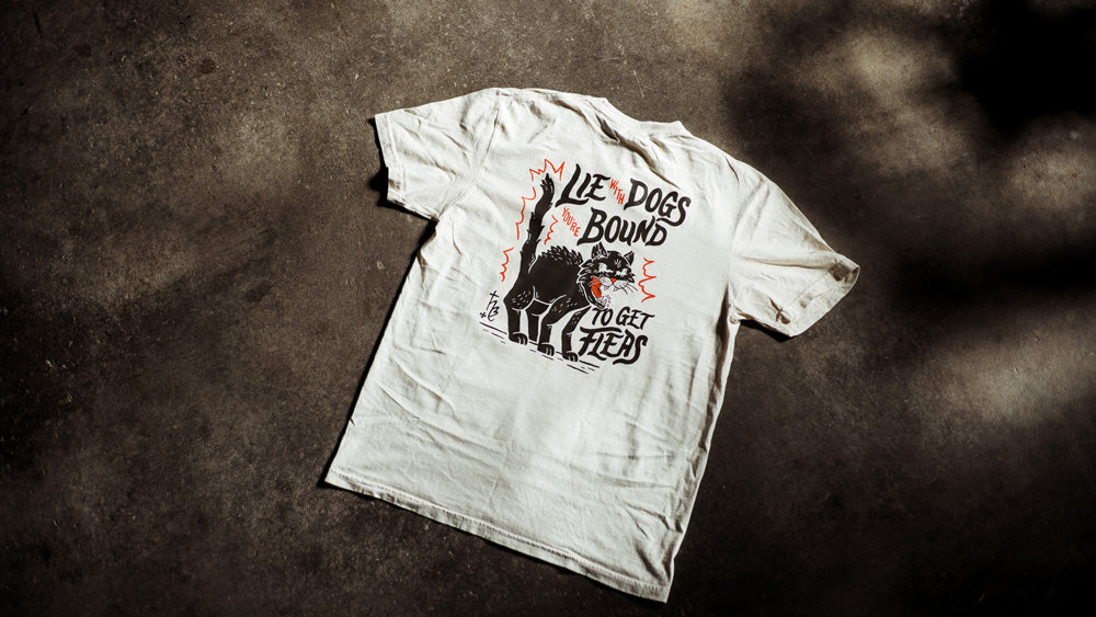 Lie With Dogs Tee by Rich Dam